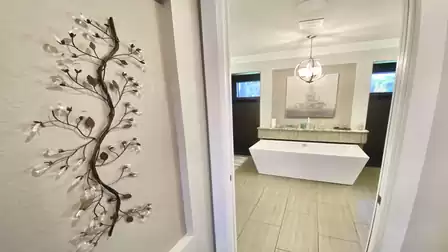 Hallway with a view of the bathroom