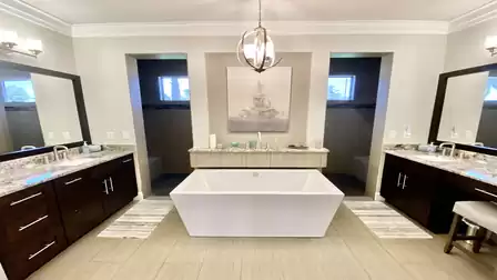 The bathroom offers two separate sinks