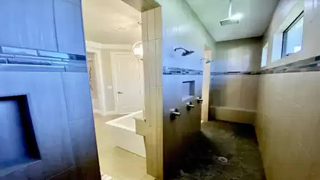 Walk-in shower from both sides in the main bathroom