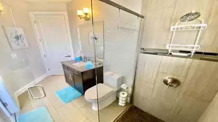 The second bathroom features a shower