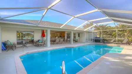 A covered patio is part of the pool area