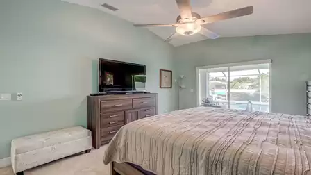 The master bedroom also features a large TV