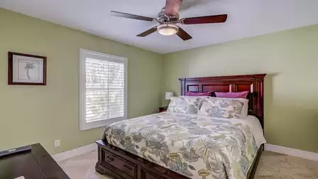 A Queen size bed can be found in the second bedroom