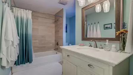 The second bathroom features a tub