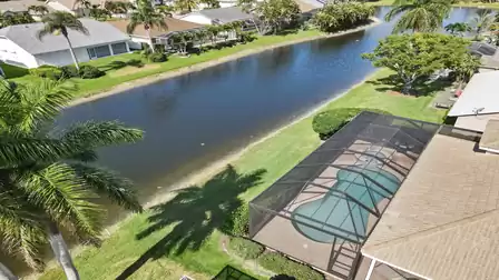 View from above of the pool / spa and the water behind the house