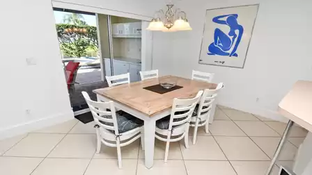 Another dining area in front of the kitchen with access to the terrace