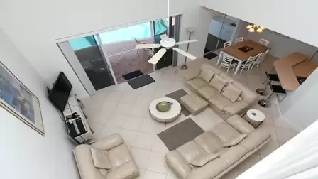 View of the living and dining area from the gallery