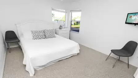 The second bedroom offers a Queen size bed