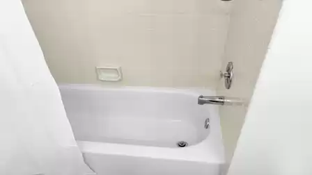 The second bathroom offers a combination with bath tup and shower