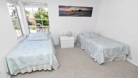 Two Twin beds are set up in the fourth bedroom