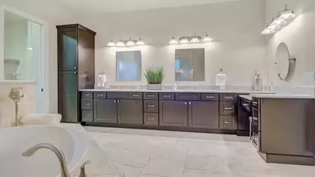 The adjoining bathroom offers ample space