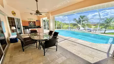 Dining table, summer kitchen, pool and view! Everything there