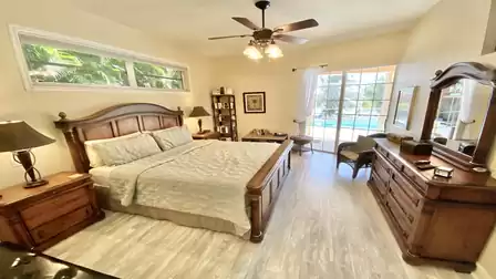 Master bedroom with king-size bed and access to the terrace