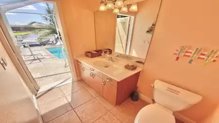 Bathroom with direct access to the pool area