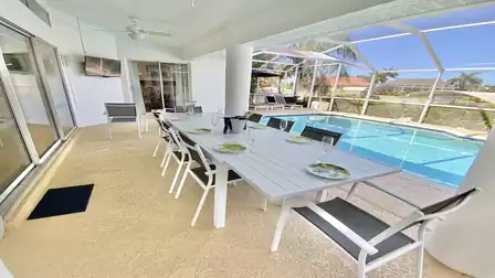 Modern dining area right by the pool