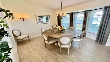 The large dining area comfortably seats up to 8 people.