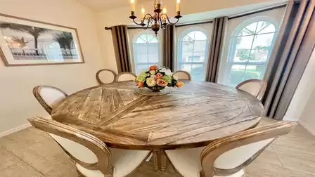 The dining table offers plenty of space for culinary delights