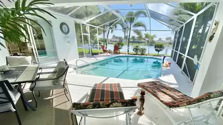 Picturesque view from the terrace over the pool to the lake