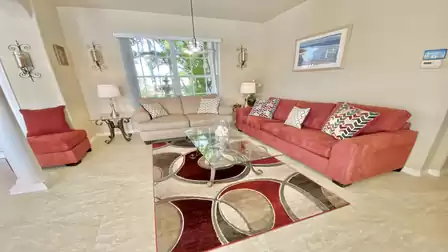 From the 2nd living room you have a great view of the tropical front garden