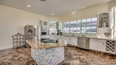 The large, all white kitchen leaves nothing to be desired