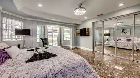 View from the master bedroom to the terrace and the pool