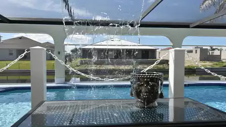 View to pool through the playful waterfall