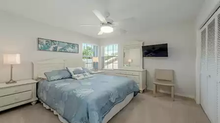 A second bedroom with a king-size bed on the upper floor