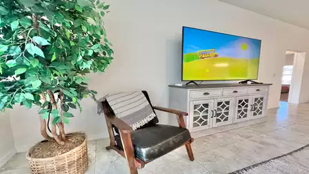Cozy armchair with TV – perfect for relaxing.