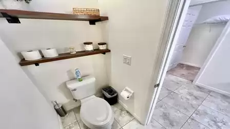 Modern guest bath with stylish shelves