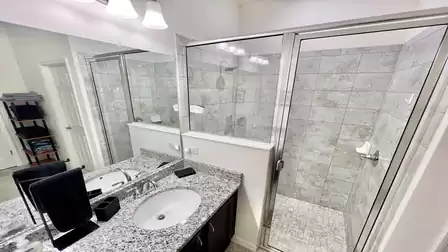 Bathroom with shower and bathtub.