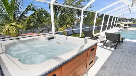 Watch passing boats from the heated hot tub