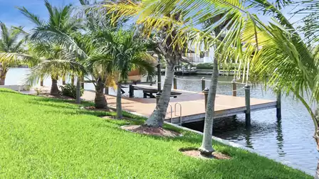 Palm trees line the canal front