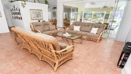 Large sliding glass doors open from the living room to the terrace