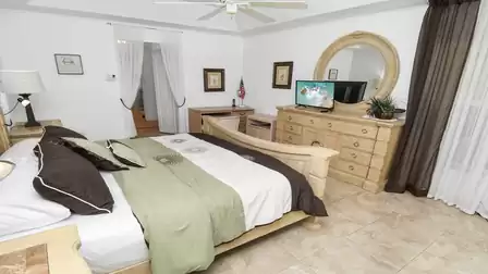 The bedroom captivates with its delicately understated ambience