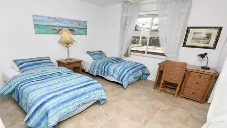 Spacious bedroom with two single / Twin beds and desk