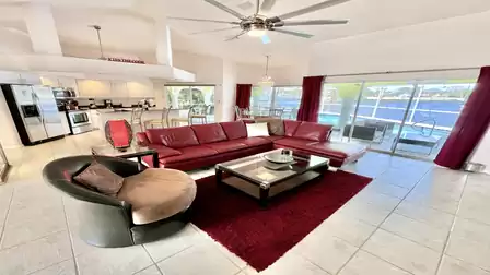 The living room, kitchen, and dining area flow seamlessly into one another.