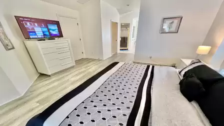 There is also a large-screen TV in the master bedroom