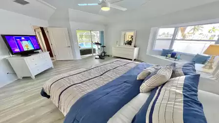 The 2nd bedroom, decorated in blue and white, also has direct access to the terrace