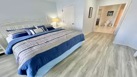 View of the double bed and the directly adjacent bathroom