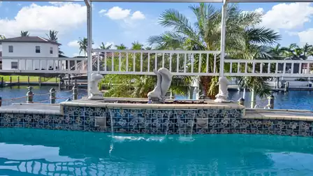 Unwind and enjoy the view of the canal directly from the pool