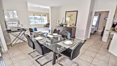 Lots of glass and chrome in the modern dining area