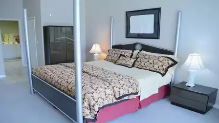 Modern bedroom with poured-over bed