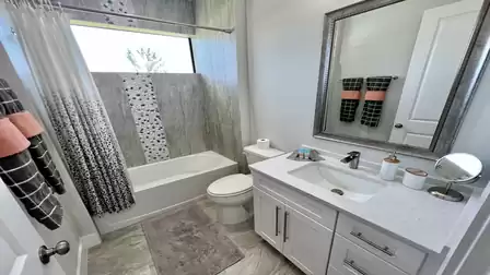 This bathroom has a bath-shower combination