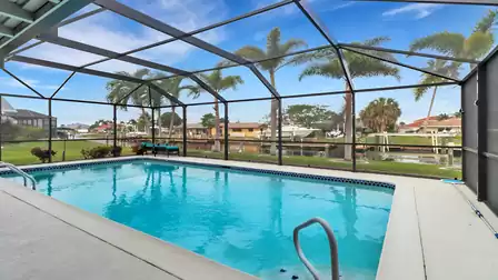 View from the pool to the canal and the houses opposite