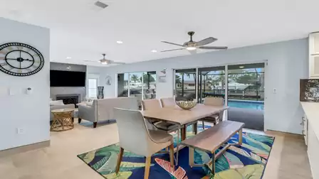 The dining area is located directly in front of the kitchen