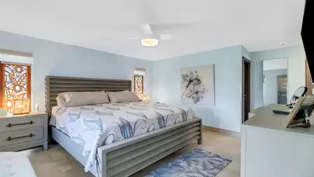 The king-size bed in the master bedroom has plenty of space for two people