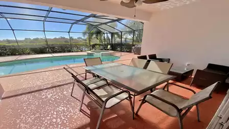 Dining table and cozy seating area on the covered terrace