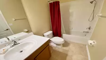 This bathroom belongs to the bedroom with the queen size bed