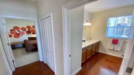 Another view into the bathroom and the 2nd bedroom with the single beds