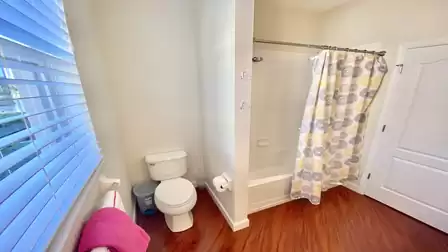 A combo tub shower and a toiled are there too 